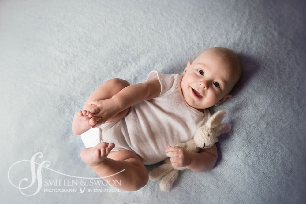 smiling photo of baby with bunny