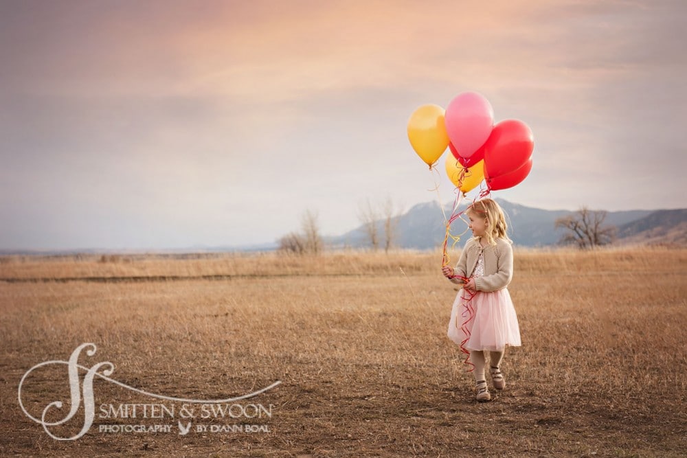 four year old girl in pink dress walking with balloons {boulder child photographer}