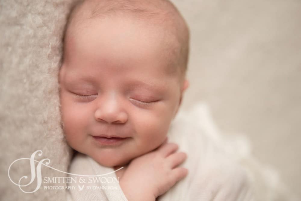 sleeping newborn girl smile