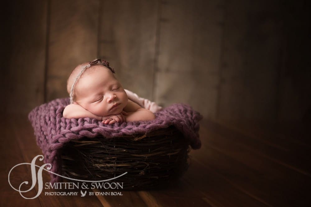 newborn baby sleeping pose in basket with lavender blanket {boulder newborn photographer}