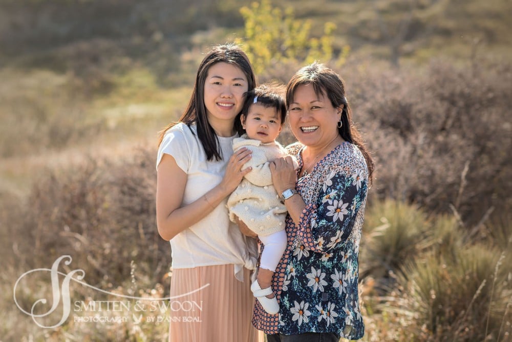 grandmother mom and baby smiling in a field {boulder family photographer
