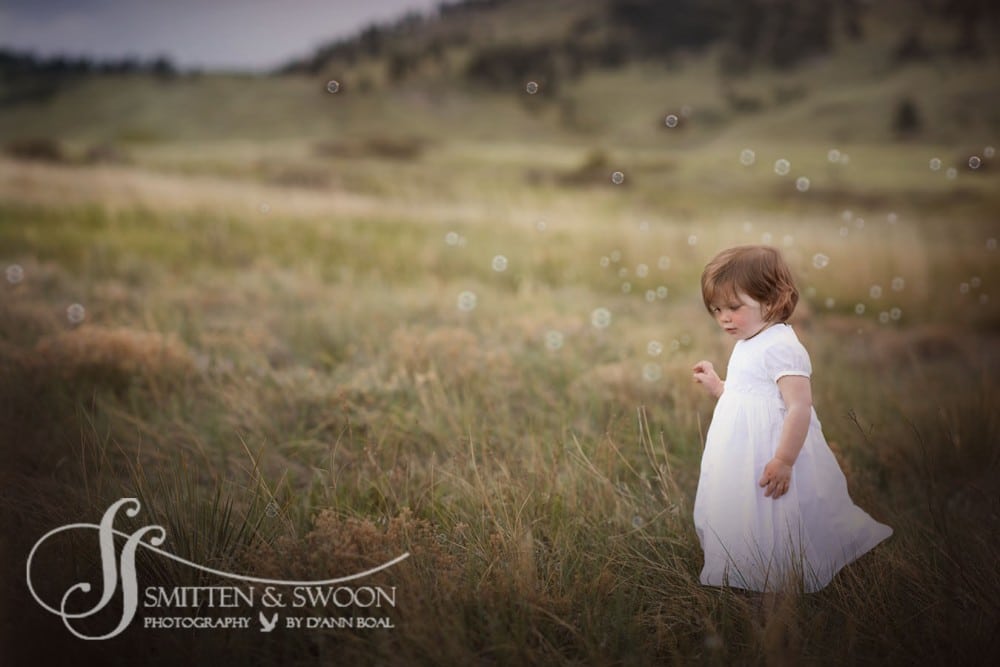 girl in field with bubbles {boulder baby photographer}