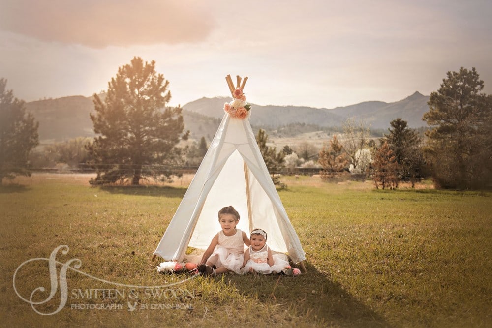 little girls sitting in teepee with flowers {boulder child photographer}