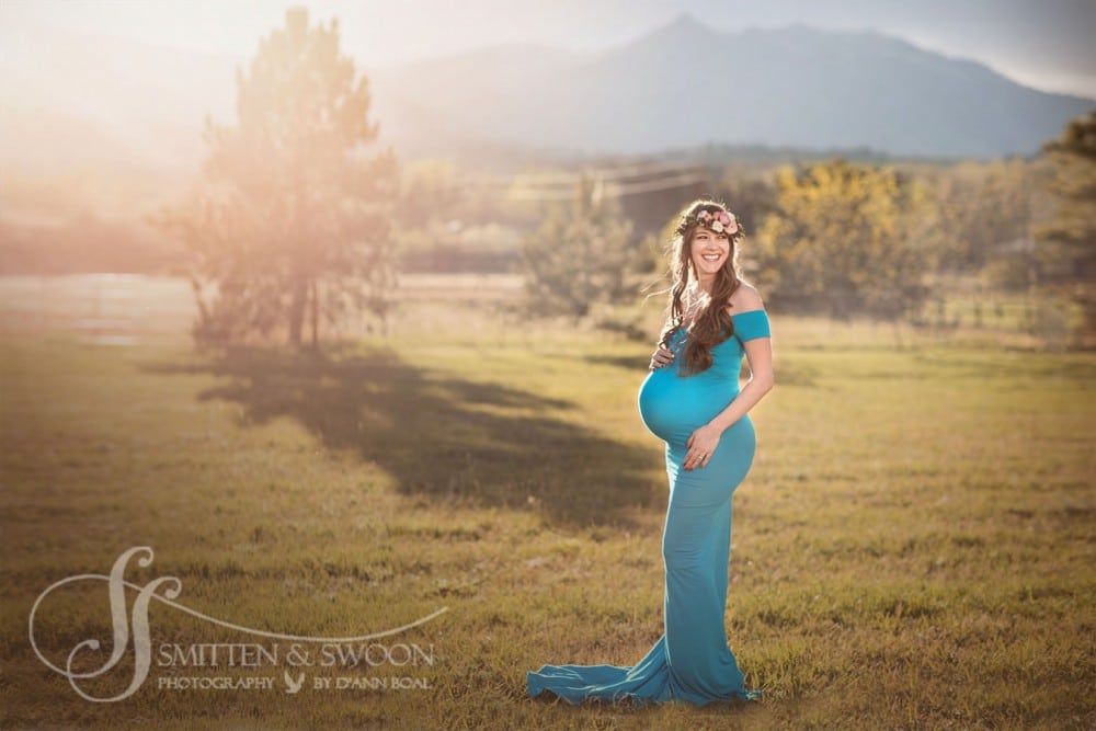 pregnant mother with flower crown in field at sunset {boulder maternity photographer}