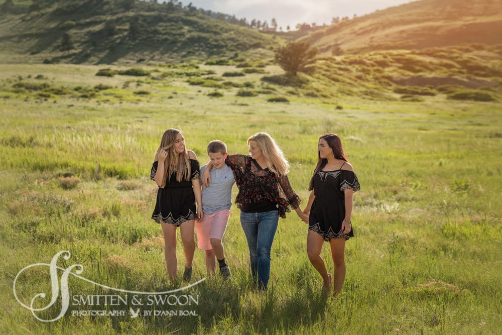 family of four walking through field {boulder family photographer}