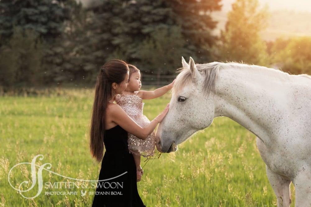 mother and daughter petting white horse {boulder family photographer}