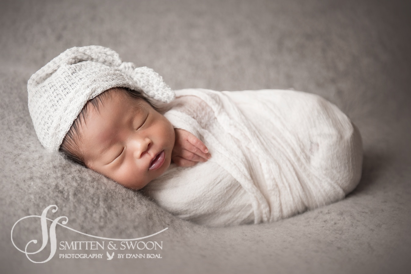 newborn baby boy wrapped in white with gray hat sleeping - boulder newborn photographer