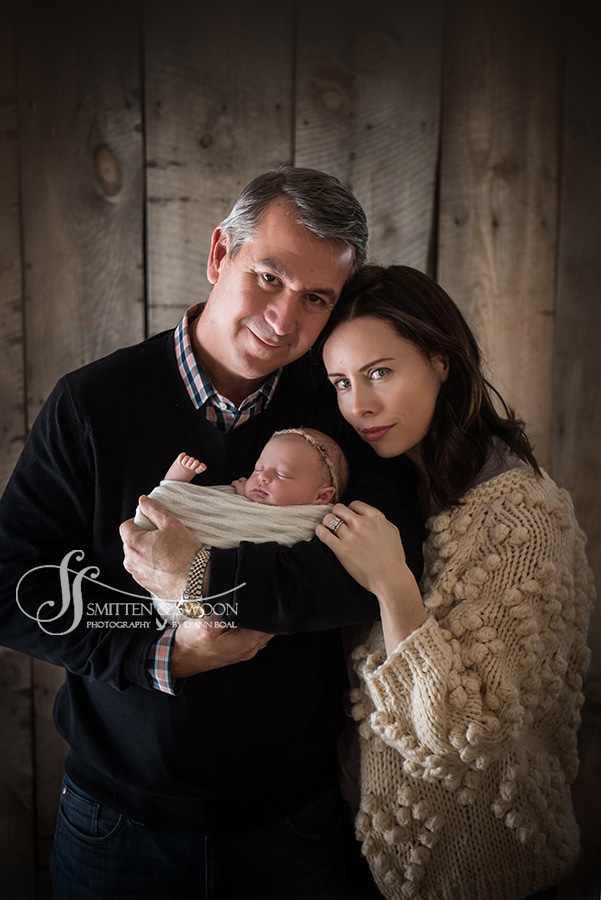 portrait family with newborn baby wrapped in white boulder baby photographer