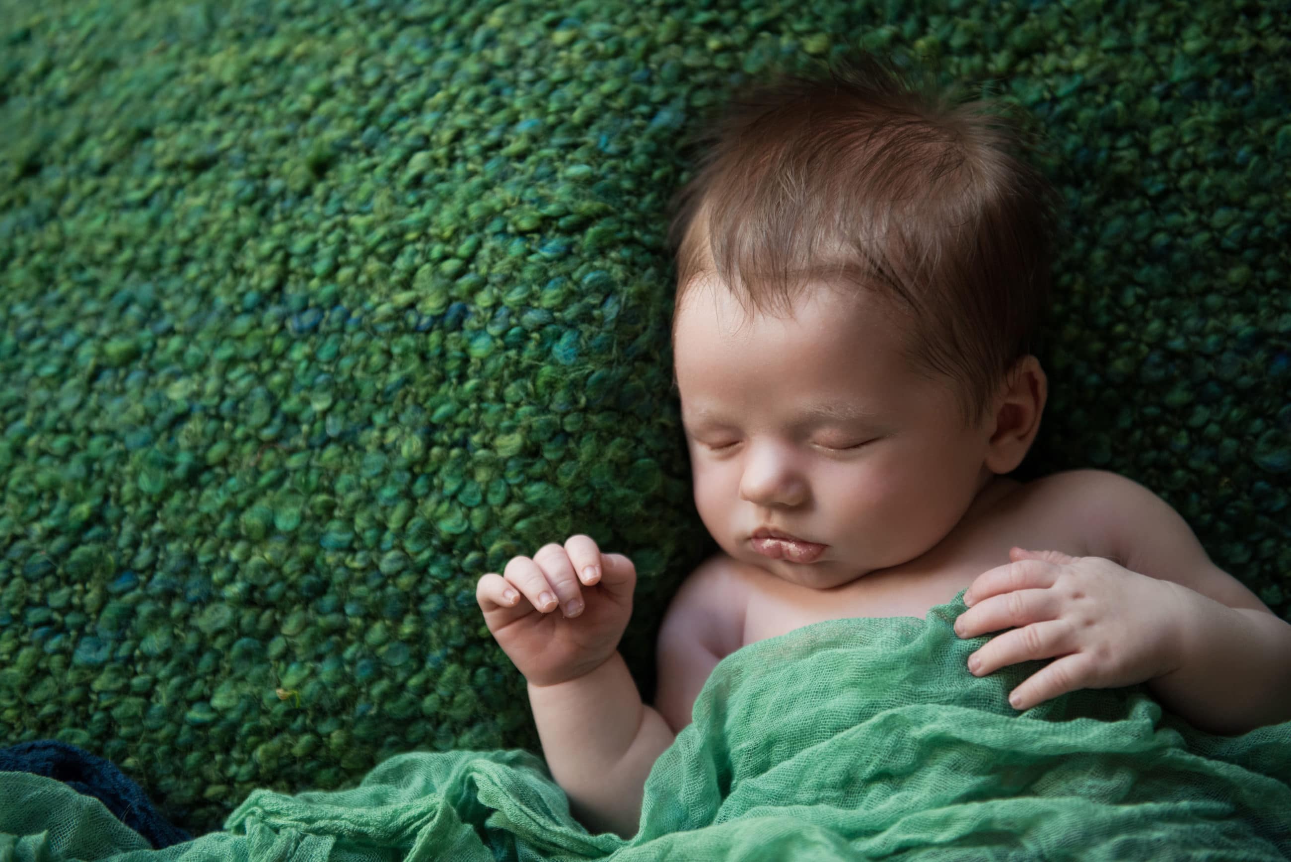 newborn baby sleeping in green blanket - boulder photographer
