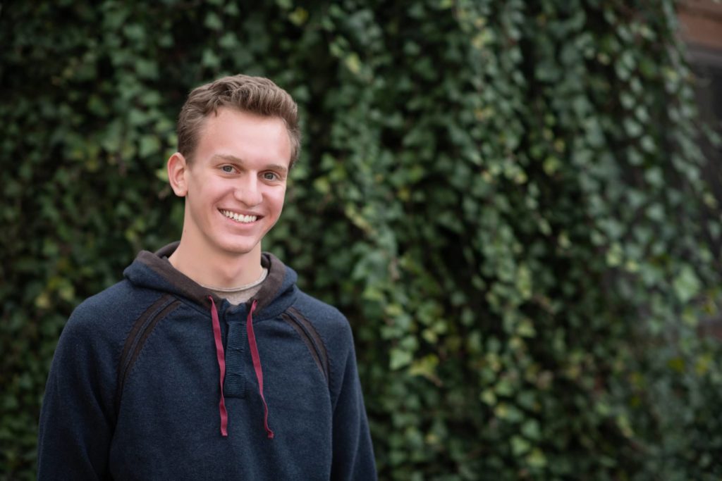 high school senior guy ivy wall - Boulder photographer