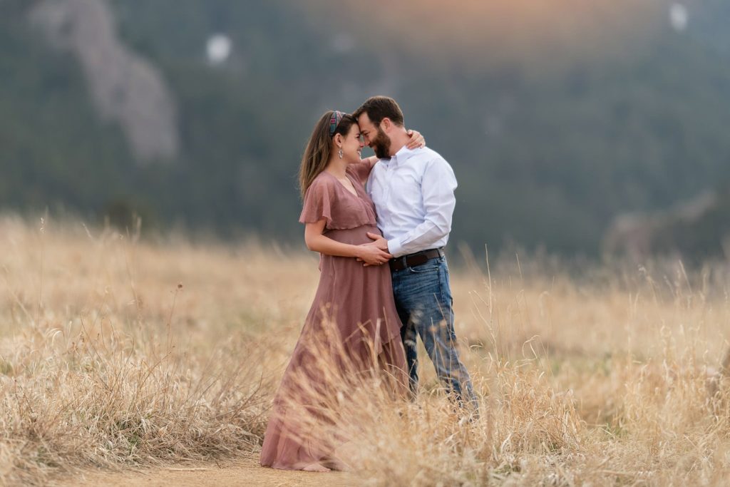 maternity photo couple standing in colorado field - Boulder photographer