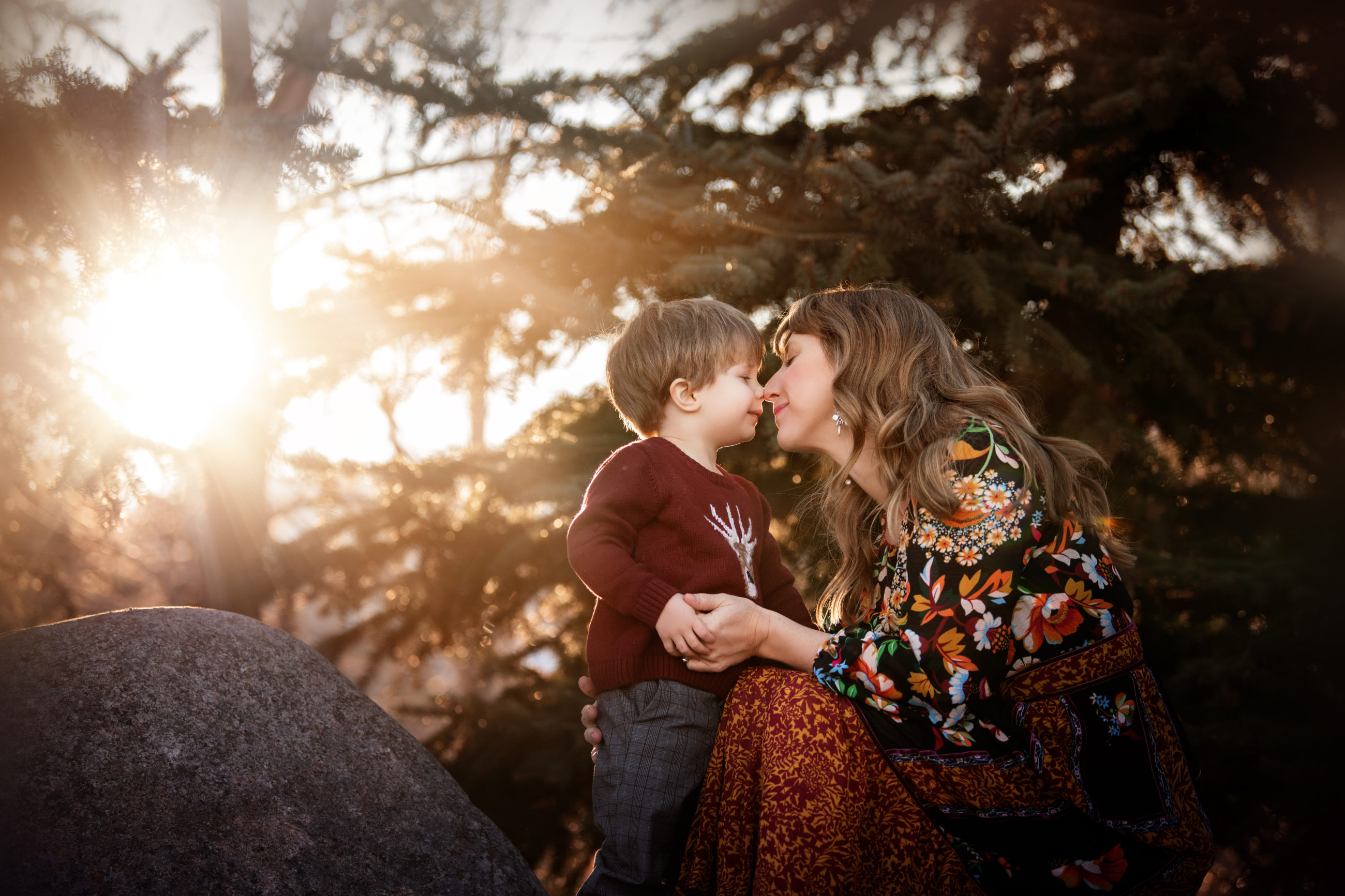 mom and son hugging in strong backlight boulder photographer