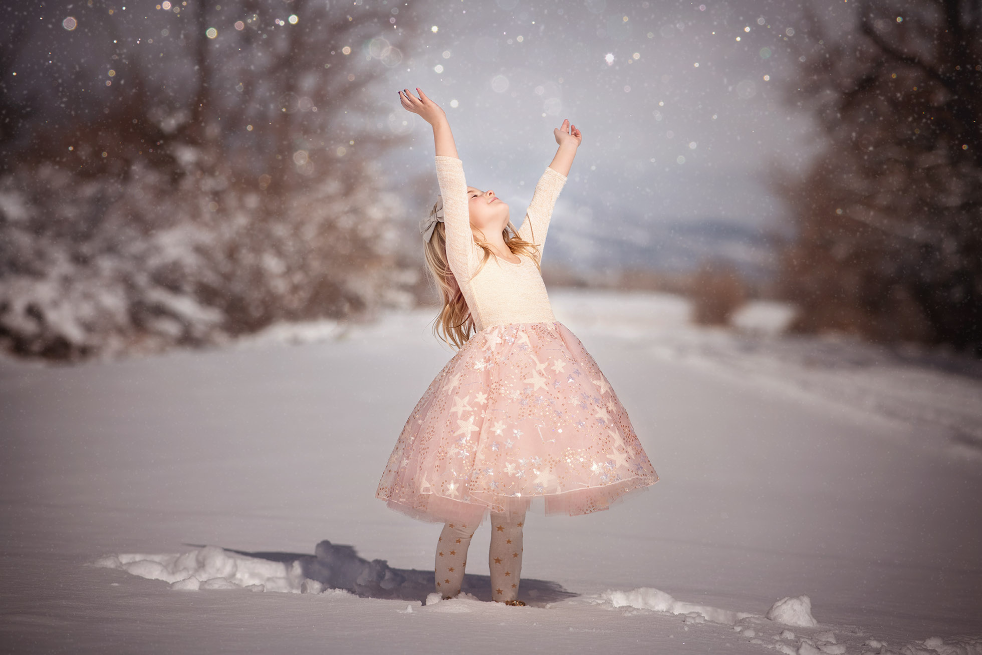 boulder's best child photographer - snowstorm with happy girl