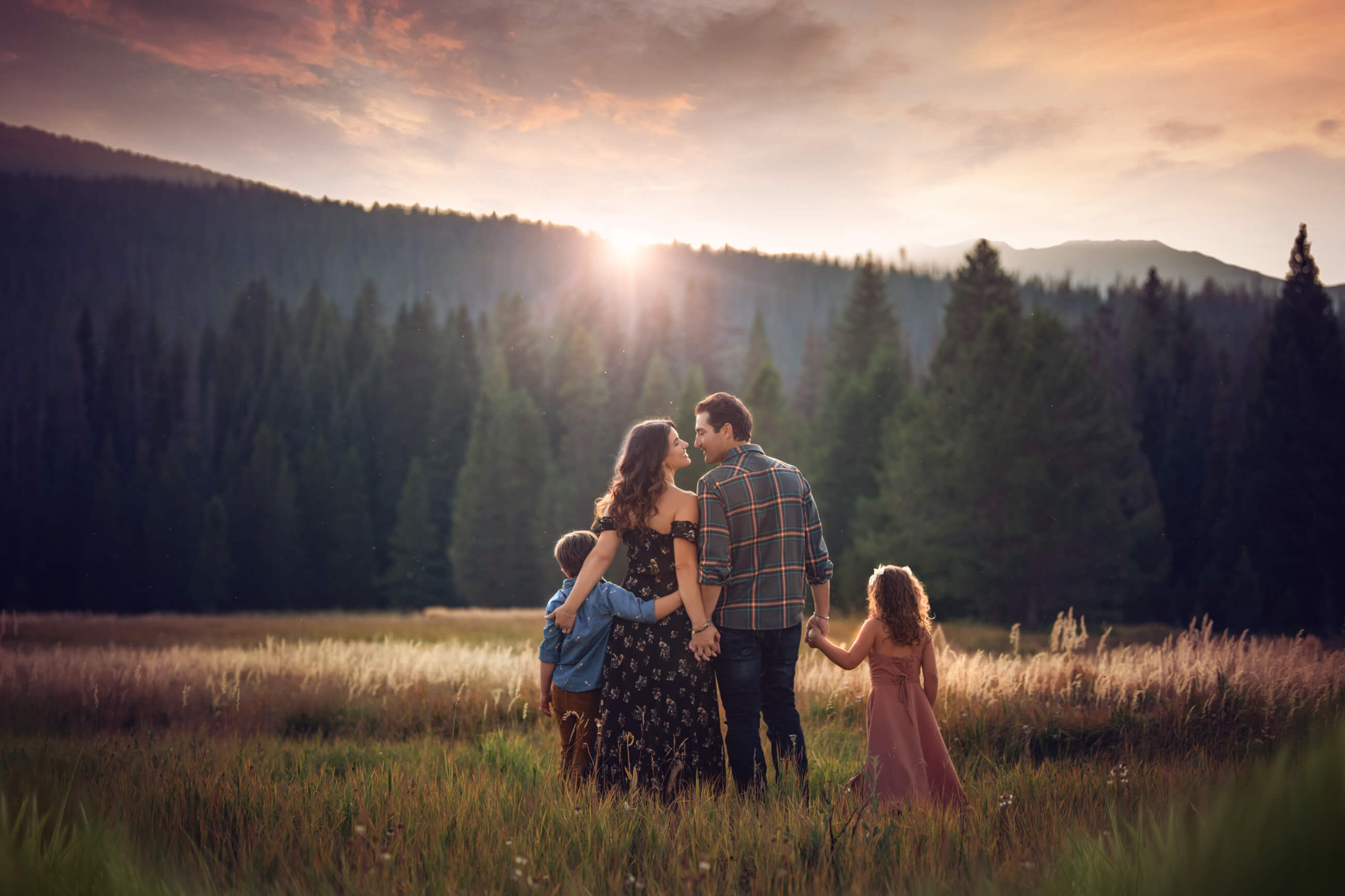 family of four in field at sunset - boulder's best photographer 